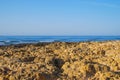 Wild summer ocean beach, Portugal. Clear sky, Rocks on sand Royalty Free Stock Photo