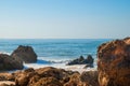 Wild summer ocean beach, Portugal. Clear sky, Rocks on sand Royalty Free Stock Photo