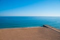 Wild summer ocean beach, Portugal. Clear sky, Rocks on sand Royalty Free Stock Photo