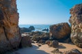 Wild summer ocean beach, Portugal. Clear sky, Rocks on sand Royalty Free Stock Photo