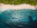 Wild tropical sandy beach and blue ocean with waves at Bali. Aerial view Royalty Free Stock Photo