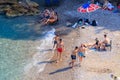 Wild Turkish beach in the Bay of the mountain coast of the Mediterranean Sea. August 7, 2022 Beldibi , Turkey Royalty Free Stock Photo