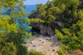 Wild Turkish beach in the Bay of the mountain coast of the Mediterranean Sea. August 7, 2022 Beldibi , Turkey Royalty Free Stock Photo