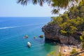 Wild Turkish beach in the Bay of the mountain coast of the Mediterranean Sea. August 7, 2022 Beldibi , Turkey Royalty Free Stock Photo