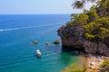 Wild Turkish beach in the Bay of the mountain coast of the Mediterranean Sea. August 7, 2022 Beldibi , Turkey Royalty Free Stock Photo