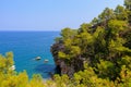 Wild Turkish beach in the Bay of the mountain coast of the Mediterranean Sea. August 7, 2022 Beldibi , Turkey Royalty Free Stock Photo