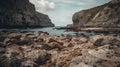 Wild, unspoiled and deserted rocky beach with high cliffs and an island in the background Royalty Free Stock Photo