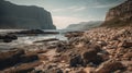 Wild, unspoiled and deserted rocky beach with high cliffs and an island in the background Royalty Free Stock Photo