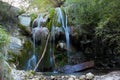 Wild waterfall inside a forest