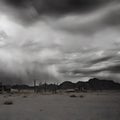 Wild west desert cloudy sky creepy scene distant strong storm brewing