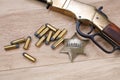 Wild west gun with ammunition and marshal badge Royalty Free Stock Photo