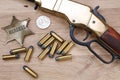 Wild west gun with ammunition and marshal badge Royalty Free Stock Photo