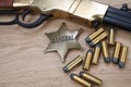 Wild west gun with ammunition and marshal badge Royalty Free Stock Photo