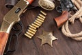 Wild west guns, ammunition and marshal badge