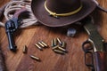 Wild west guns, ammunition and silver dollars Royalty Free Stock Photo