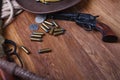 Wild west guns, ammunition and silver dollars Royalty Free Stock Photo