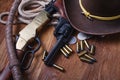 Wild west guns, ammunition and silver dollars Royalty Free Stock Photo