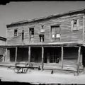 Wild wild west ghost town old saloon wooden building old iron wheel