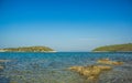 Wilderness beach scenic view on two island shore line with Mediterranean sea bay summer day time landscape clear weather and empty Royalty Free Stock Photo