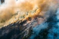 Wildfire aerial view. Fire and smoke. Burning forest. Natural disaster from climate change. Dry grass and trees burns Royalty Free Stock Photo