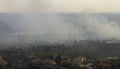 Wildfire burning severely during dry winter season in North Port city, Florida. Thick smoke rising up over suburb homes Royalty Free Stock Photo