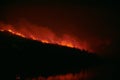 Wildfire disaster - fire burning mountain in night time Royalty Free Stock Photo