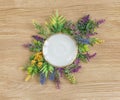 Wildflowers and empty white porcelain plate Royalty Free Stock Photo