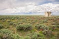 Wildflowers And Sagebrush In Meadow With Oifield Tanks In Background