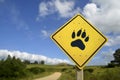 Wildlife animal concept with paw icon on road sign Royalty Free Stock Photo