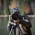 Wildlife photographer outdoor in action Royalty Free Stock Photo