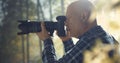 Wildlife photographer shooting in a forest