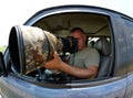 Wildlife photographer sitting in the car