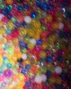 Wildly piled up colorful balls lit and blurred