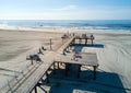 WILDWOOD, NEW JERSEY, USA - June 25, 2017: Crest beach and wooden dock from above with the ocean view and tourists relaxing