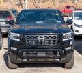 Wilkins Township, Pennsylvania, USA November 24, 2022 A new, black four door Nissan Frontier pickup truck for sale
