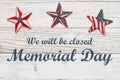 Closed Memorial Day sign with retro American USA flag stars on weathered wood Royalty Free Stock Photo