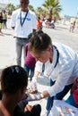 This will make you better in no time. a volunteer nurse giving injections to underprivileged kids.