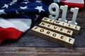 911 We will Never Forget alphabet letters with USA Flag on wooden background