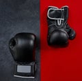 Will there be a knock out. High angle shot of a pair of boxing gloves placed together on top of a multi coloured Royalty Free Stock Photo