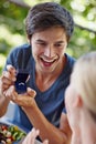 Will you be my missus. Shot of a handsome young man proposing to his girlfriend with an engagement ring. Royalty Free Stock Photo