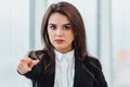 Will you join my team Young woman in suit pointing at camera, looking confident and determined. Royalty Free Stock Photo