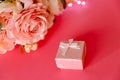 Will you marry me concept in pink. A small light pink box for greeting. Postcard