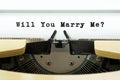 Will you marry me word on a yellow vintage typewriter. Valentines day concept. Marriage and wedding proposal Royalty Free Stock Photo