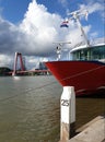 Willemsbrug and red vessel against cloudy skies