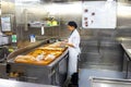 Willemstad, Curacao, Netherlands - December 5, 2019: Kitchen crew work in the galley of a cruise ship in the Caribbean Sea