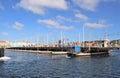 Willemstad, Curacao - 12/17/17: Queen Emma Pontoon Bridge in Curacao swinging out to allow boat passage;