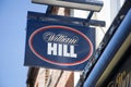 The William Hill sign hanging from a wall in the UK Royalty Free Stock Photo