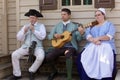 Colonial Re-enactors playing whistle and Guitar. Williamsburg, VA, USA. April 11, 2015. Royalty Free Stock Photo