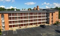 The front view of the rooms and empty parking lot of Hampton Inn and Suites Royalty Free Stock Photo