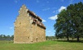 Willington Dovecot and trees on a sunny day.